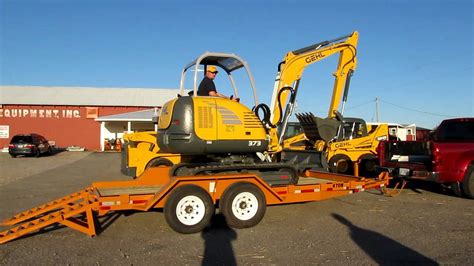 mini excavator in truck bed|mini on flatbed truck.